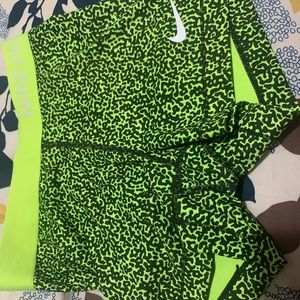 Black/green Nike shorts